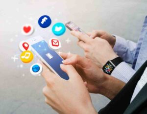 people using smartphones displaying social media icons